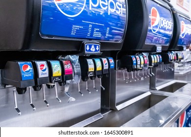 Sacramento, CA/USA Feb 12, 2020: Pepsi soda fountain inside Costco Warehouse food court allows customers to fill up their drinks and get free refills
