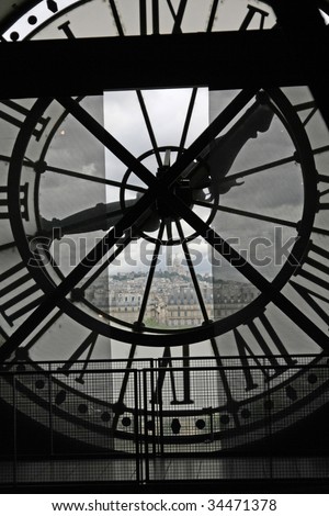 The Sacre Coeur seen through a window of museum D'Orsay, in Paris
