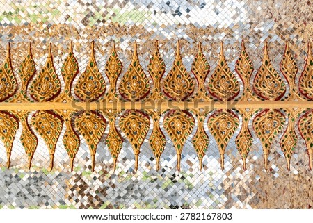 Sacred geometric ceiling pattern inside a Thai temple featuring symmetrical gold motifs, mirrored surfaces, and intricate Buddhist decorative artistry.