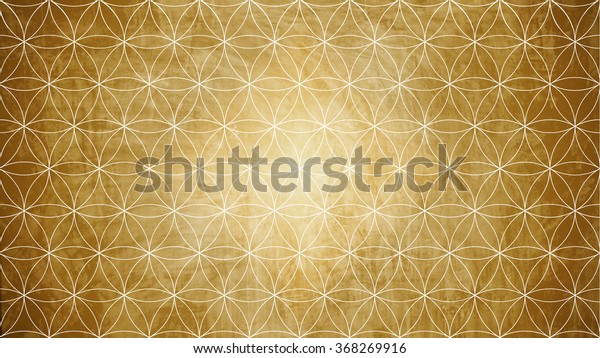 Sacred geometry in flower pattern shape on old paper\
texture 