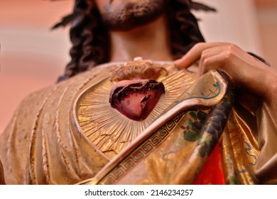 Sacred Heart of Jesus Christ Statue close-up. Jesus shows his own heart, symbol of God's love