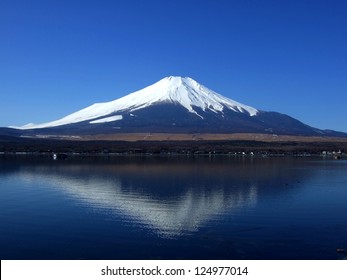 The Sacred Mountain Of Fuji In The Background Of Blue Sky At Japan