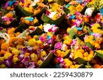 Sacrificial offering flowers floral set in banana leaf basket for thai people respect praying and rite offer to deity angel god blessing wish mystery in Wat Saphan Sung temple in Nonthaburi, Thailand
