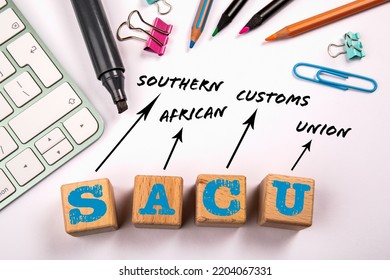 SACU - Southern African Customs Union. Wooden Blocks On A White Office Table.