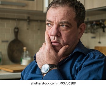 Sad 45-50 Years Old Man In The Interior Of His Room Close-up Portrait