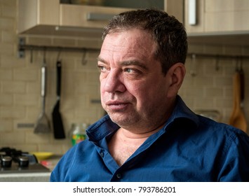 Sad 45-50 Years Old Man In The Interior Of His Room Close-up Portrait