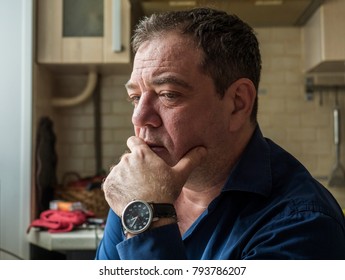 Sad 45-50 Years Old Man In The Interior Of His Room Close-up Portrait