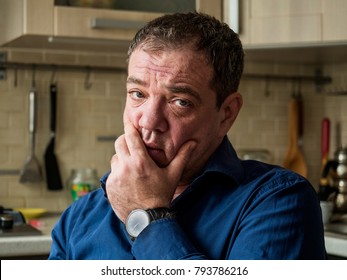 Sad 45-50 Years Old Man In The Interior Of His Room Close-up Portrait