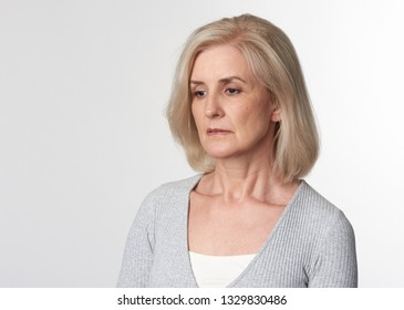 Sad 50s Years Old Woman Isolated On White Studio Wall