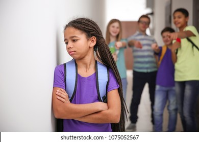 Sad African American Girl Indoors. Bullying In School