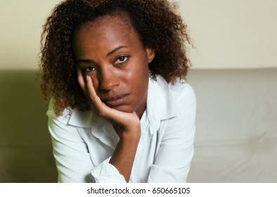 Sad African American Woman With Depression Looking At Camera