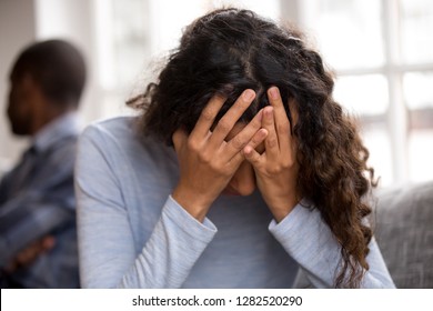 Sad African Wife Holding Head In Hands Feeling Desperate After Fight With Husband, Upset Frustrated Black Woman Victim Cry Offended Tired Of Quarreling, Problems In Bad Couple Relationships Concept