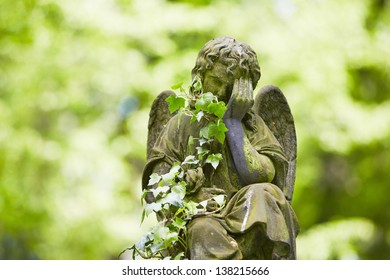 Sad Angel Statue On Old Cemetery