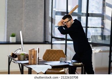 Sad Angry Business Manager In Office With Baseball Bat