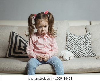 Sad Or Angry Little Girl, Victim, Holding Toy Dog