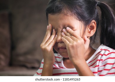 Sad Asian Child Girl Is Crying And Rubbing Her Eyes With Her Hands