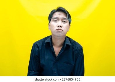 A sad asian man is crying and wiping away tears after having a problems. stressful man cries out loudly. a worker crying after losing his job. - Shutterstock ID 2276854955