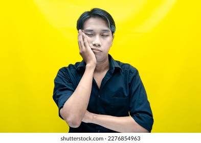 A sad asian man is crying and wiping away tears after having a problems. stressful man cries out loudly. a worker crying after losing his job. - Shutterstock ID 2276854963