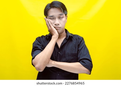 A sad asian man is crying and wiping away tears after having a problems. stressful man cries out loudly. a worker crying after losing his job. - Shutterstock ID 2276854965
