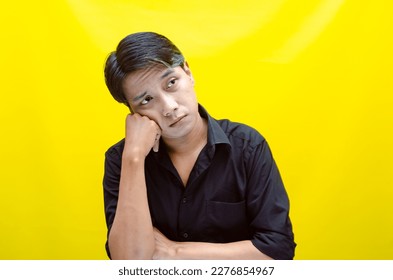 A sad asian man is crying and wiping away tears after having a problems. stressful man cries out loudly. a worker crying after losing his job. - Shutterstock ID 2276854967