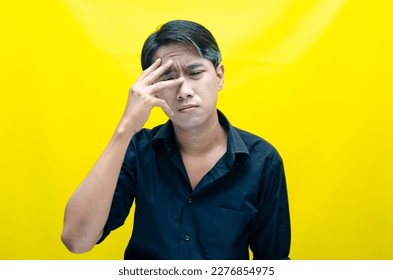 A sad asian man is crying and wiping away tears after having a problems. stressful man cries out loudly. a worker crying after losing his job. - Shutterstock ID 2276854975