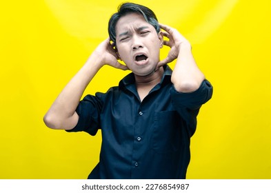A sad asian man is crying and wiping away tears after having a problems. stressful man cries out loudly. a worker crying after losing his job. - Shutterstock ID 2276854987