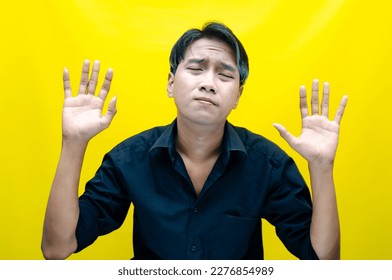 A sad asian man is crying and wiping away tears after having a problems. stressful man cries out loudly. a worker crying after losing his job. - Shutterstock ID 2276854989
