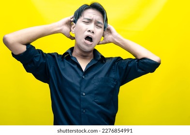 A sad asian man is crying and wiping away tears after having a problems. stressful man cries out loudly. a worker crying after losing his job. - Shutterstock ID 2276854991