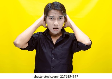 A sad asian man is crying and wiping away tears after having a problems. stressful man cries out loudly. a worker crying after losing his job. - Shutterstock ID 2276854997