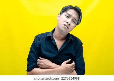 A sad asian man is crying and wiping away tears after having a problems. stressful man cries out loudly. a worker crying after losing his job. - Shutterstock ID 2276854999