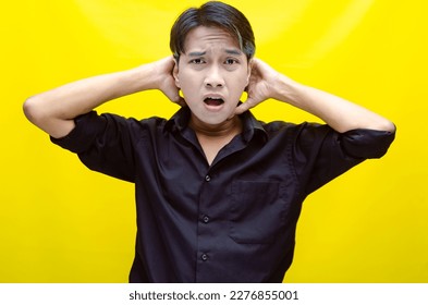 A sad asian man is crying and wiping away tears after having a problems. stressful man cries out loudly. a worker crying after losing his job. - Shutterstock ID 2276855001