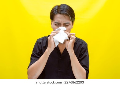 A sad Asian man is crying and wiping away tears after having problems using tissues. After losing his job, a man was seen crying deeply and wiping his tears with tissues.  - Shutterstock ID 2276862203