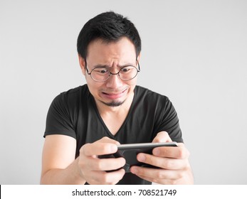 Sad Asian Man Lost The Game He Played In The Smartphone.