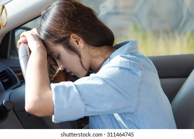 Sad Asian Woman Driver In Car