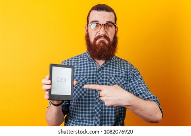 Sad Bearded Man, Low Battery On Tablet. Battery Concept