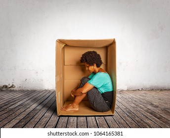 Sad Black Woman Inside A Box On A Room