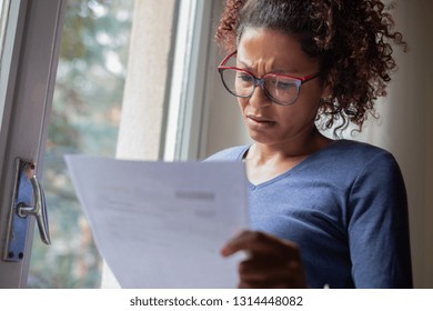 Sad Black Woman Near Window Reading Bad News Letter