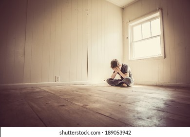 Sad Boy Alone In A Bare Room