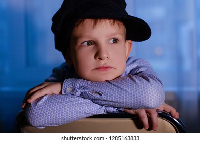 sad boy in a cap