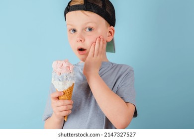 Sad Boy Eating Ice Cream And Felt A Sharp Toothache. The Child Grabbed His Cheek. Dental Care, Health Care Concept. High Quality Photo