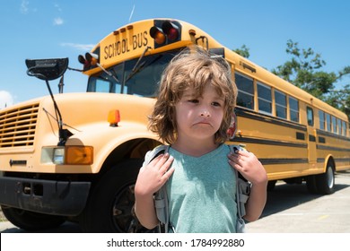 Sad Boy Front Of A School Bus. Child School Concept. Education. Home Education