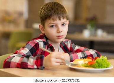 Sad Boy Has A Bad Appetite At The Table. Refusal To Eat. The Need For Proper Nutrition.
