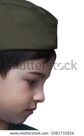 Sad boy in a military cap isolate