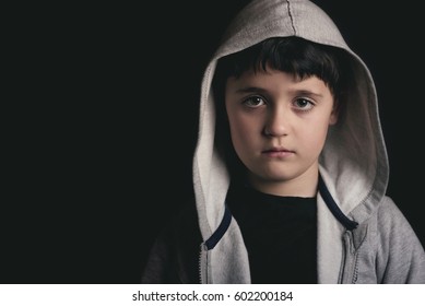 Sad Boy On Black Background
