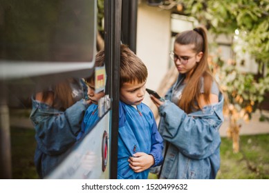 A Sad Boy Is Standing At The Door Of The Bus