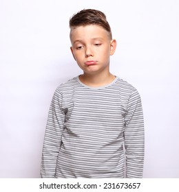 Sad Boy Standing Over White Background