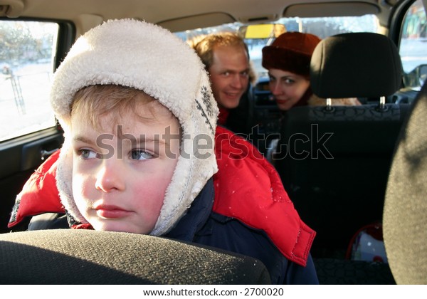 sad boy in winter family\
car