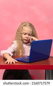 Sad, Brooding Schoolgirl Behind The Lepton. Pink Background