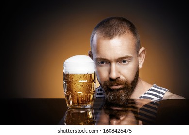 
Sad Brutal Man With A Glass Of Beer