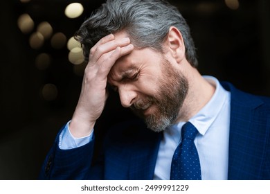 Sad business man got migraine. Man with strong headache. Stressed, tired businessman from headache. Headache, tiredness and stress, migraine. Headache pain concept. - Powered by Shutterstock